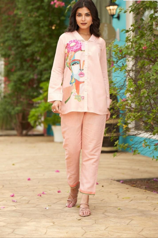 Peach colour co-ord set with figure on top